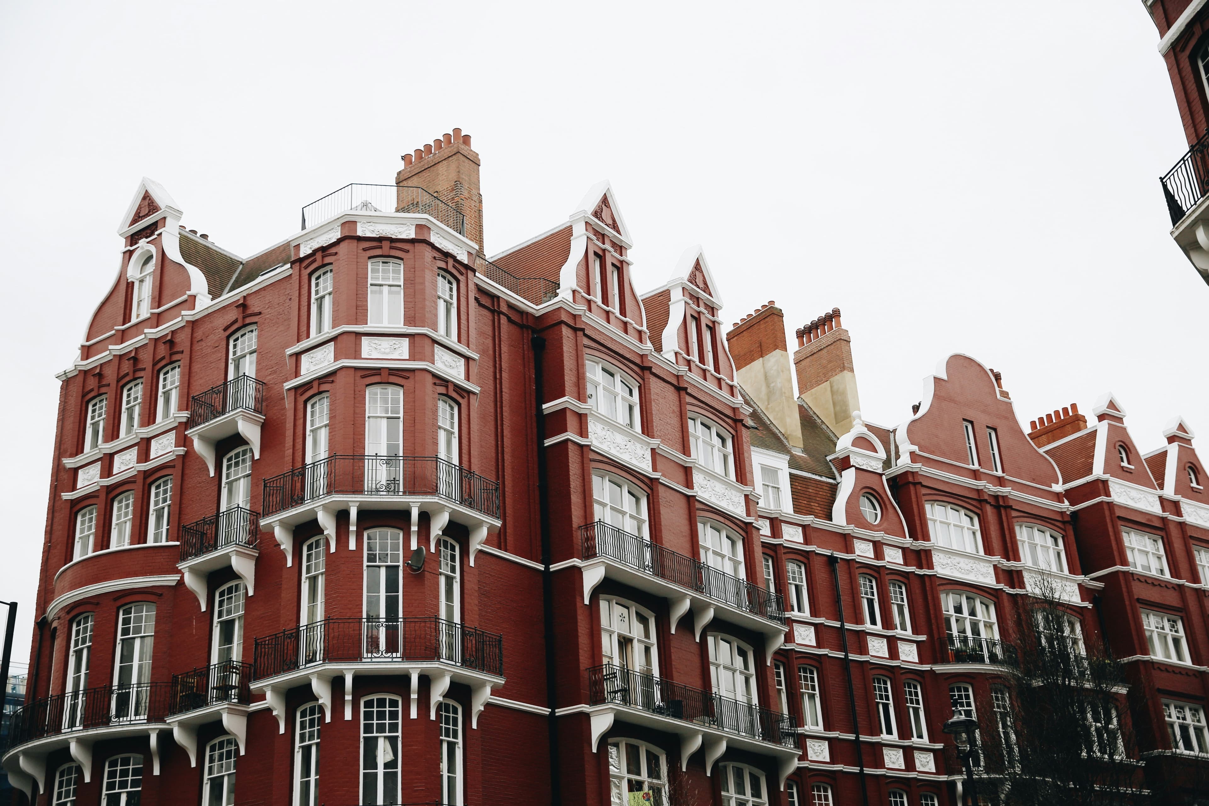 A modern UK apartment building with rows of flats, the kind usually sold leasehold