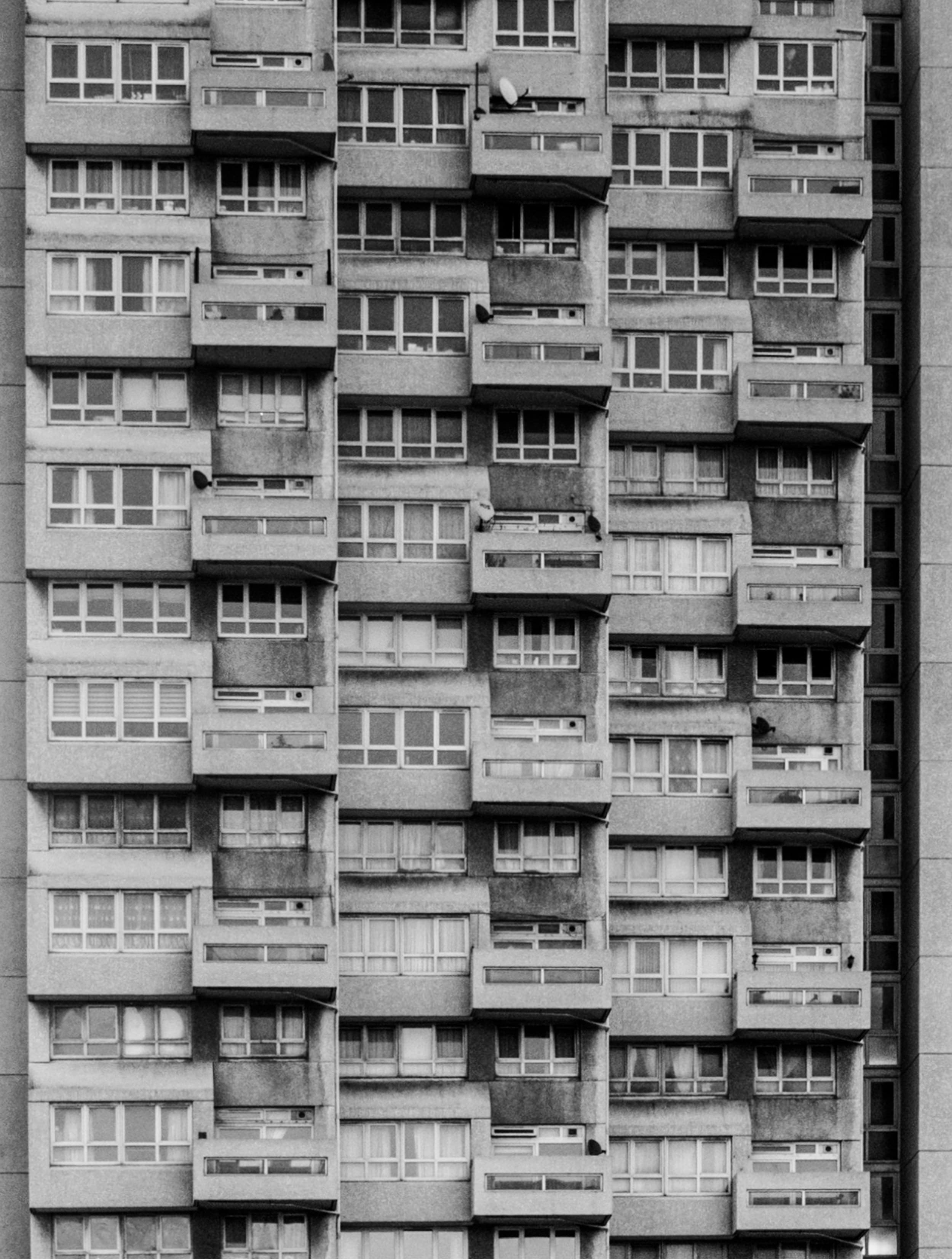 The geometric facade of a residential tower block of flats in London