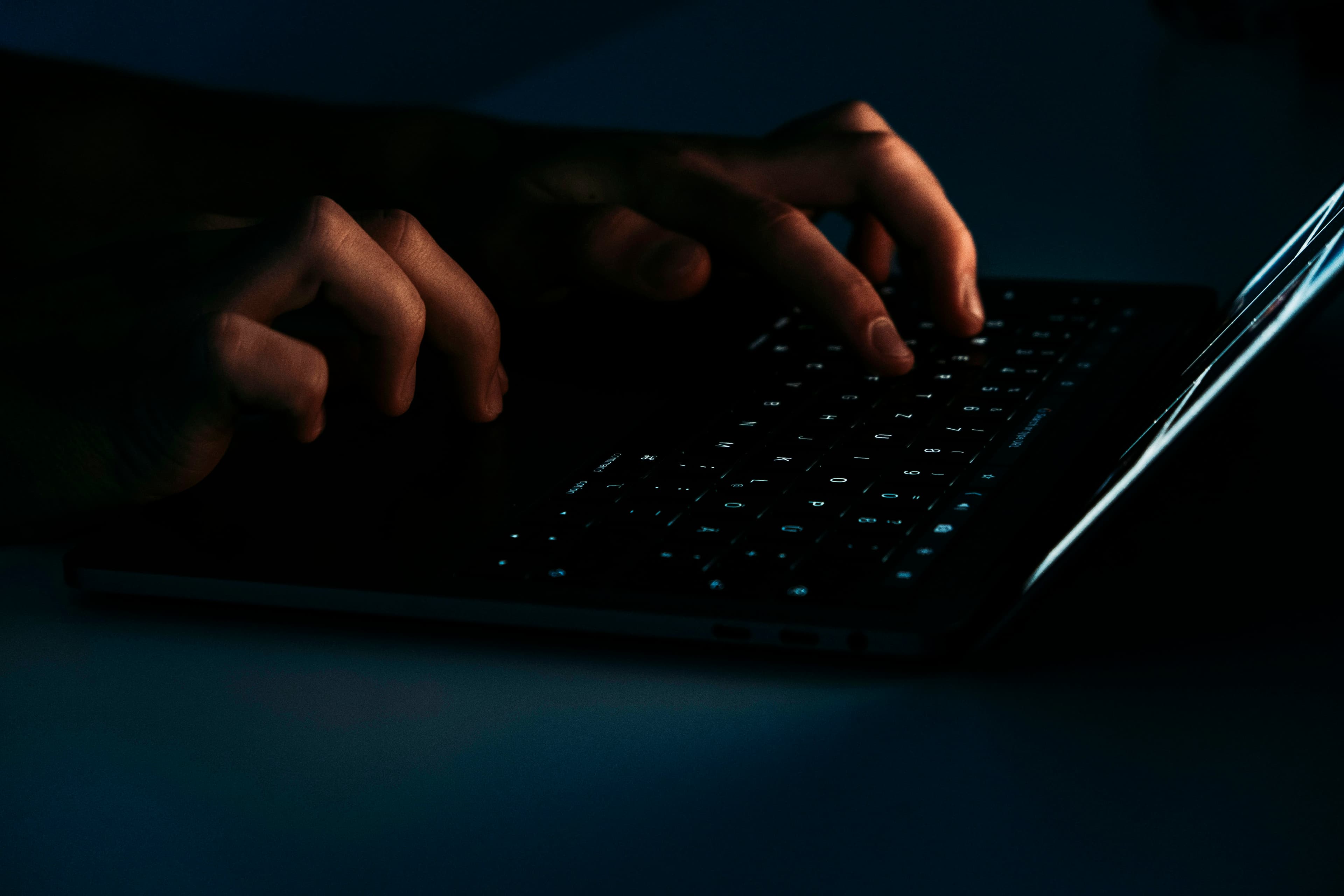 A laptop and a padlock symbol representing online security when buying or selling a home