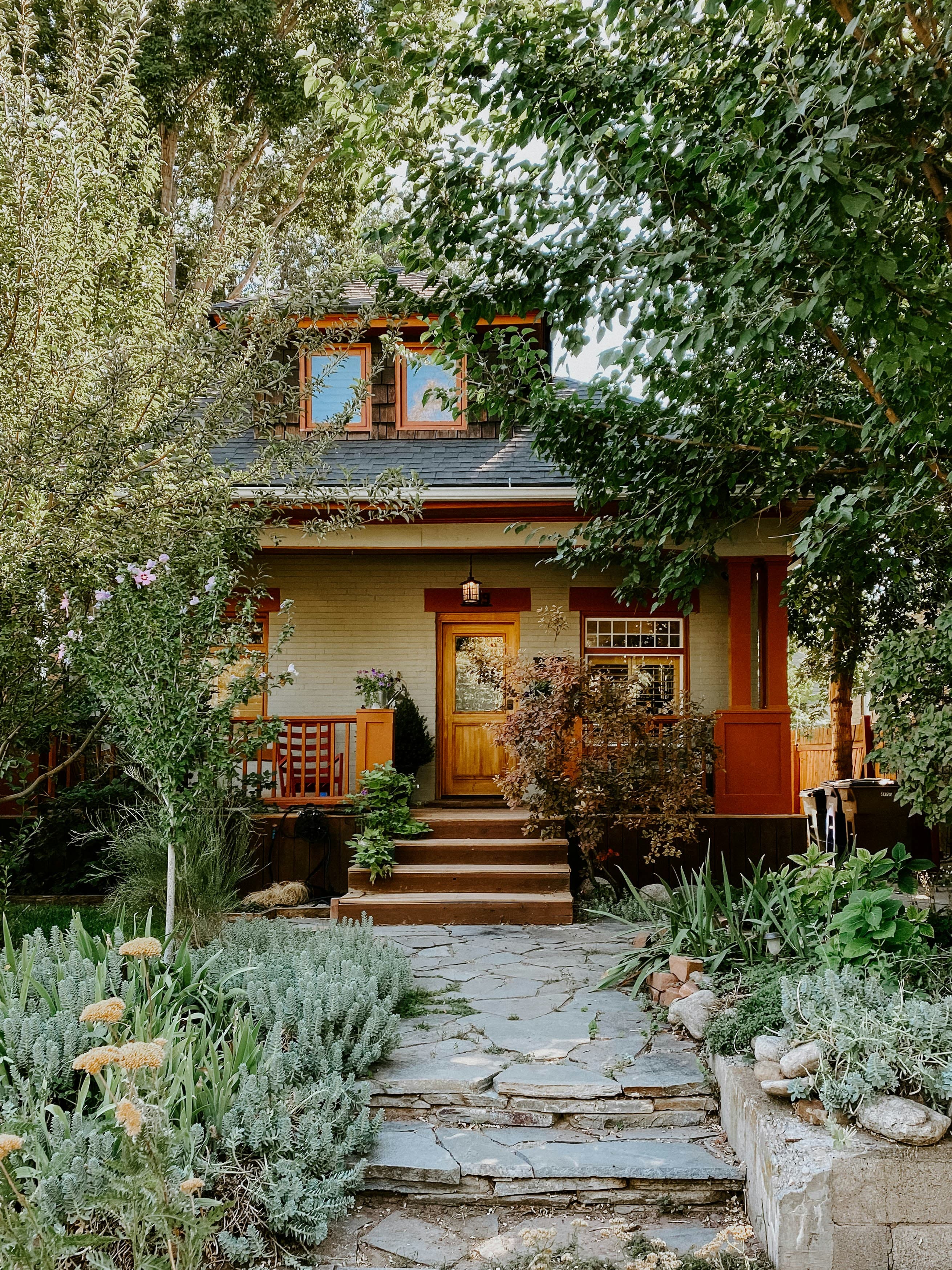 A detached house with a stone pathway leading to the front door