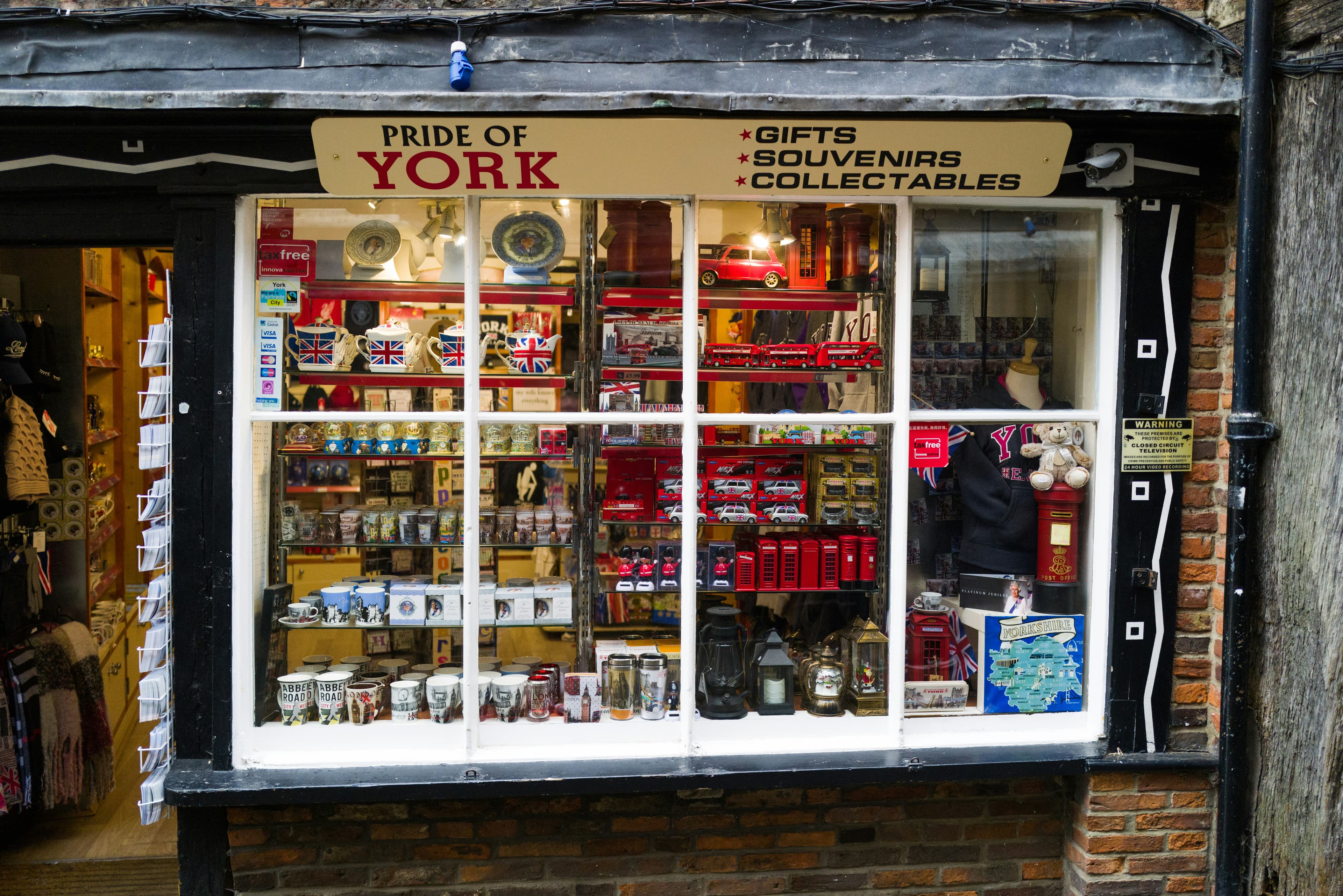 A high-street shop front with a large display window