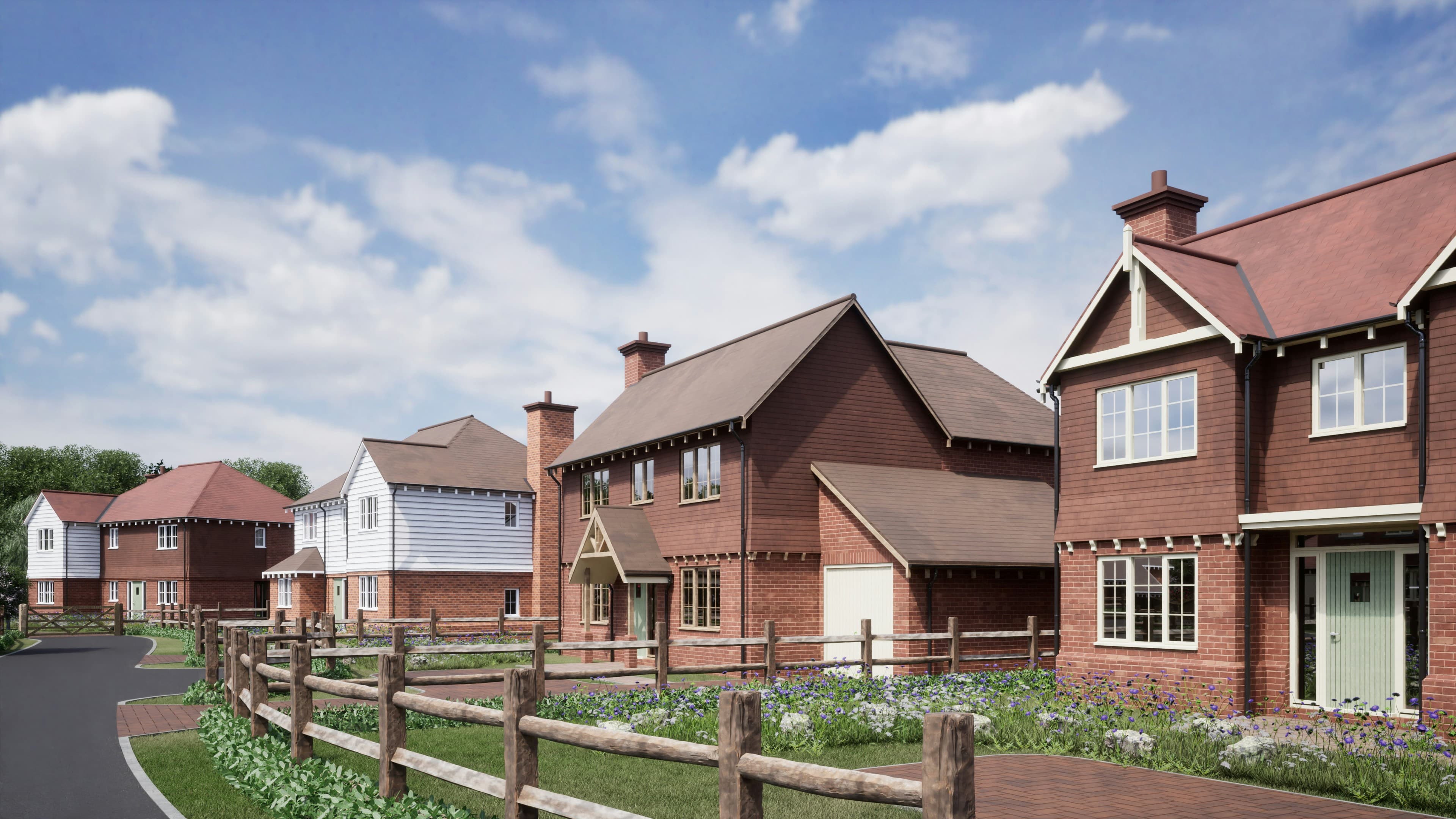 A row of red brick UK terraced houses next to a residential road