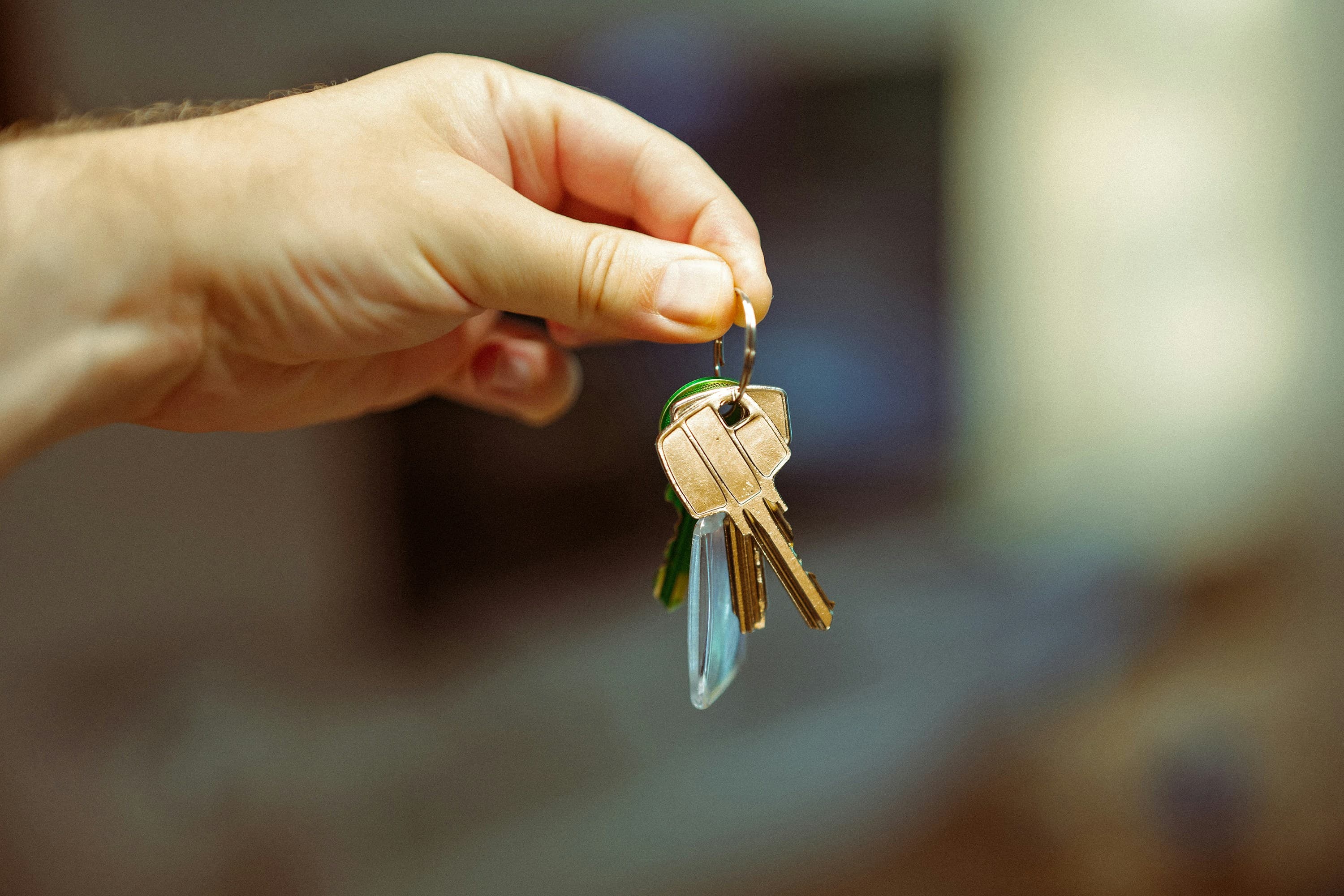 A person holding a bunch of house keys in their hand