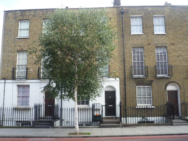 Brick terraced houses along an English residential street