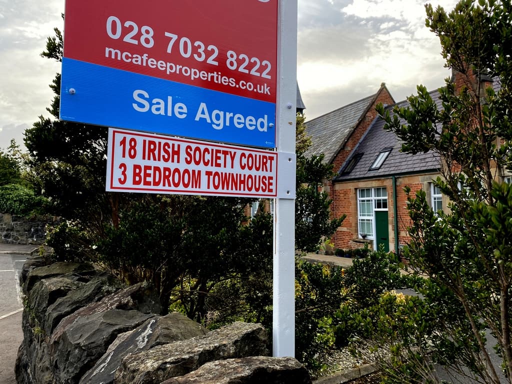 A For Sale sign outside a UK property