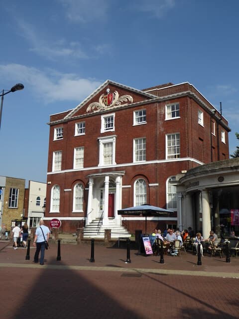 A solicitors' office on a British high street, seen from the pavement