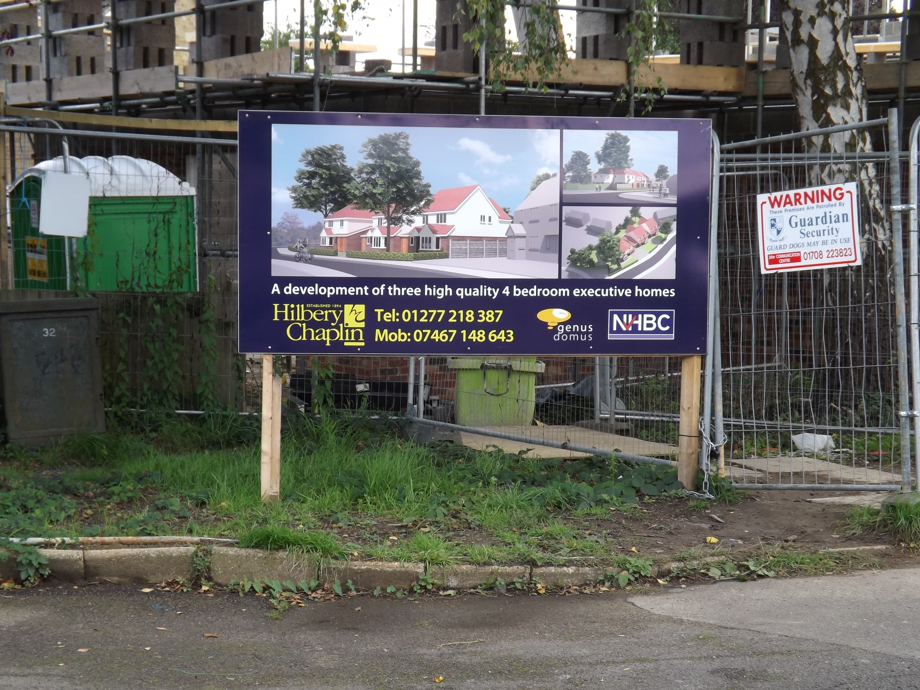 A housebuilder's for sale board advertising new homes on a development