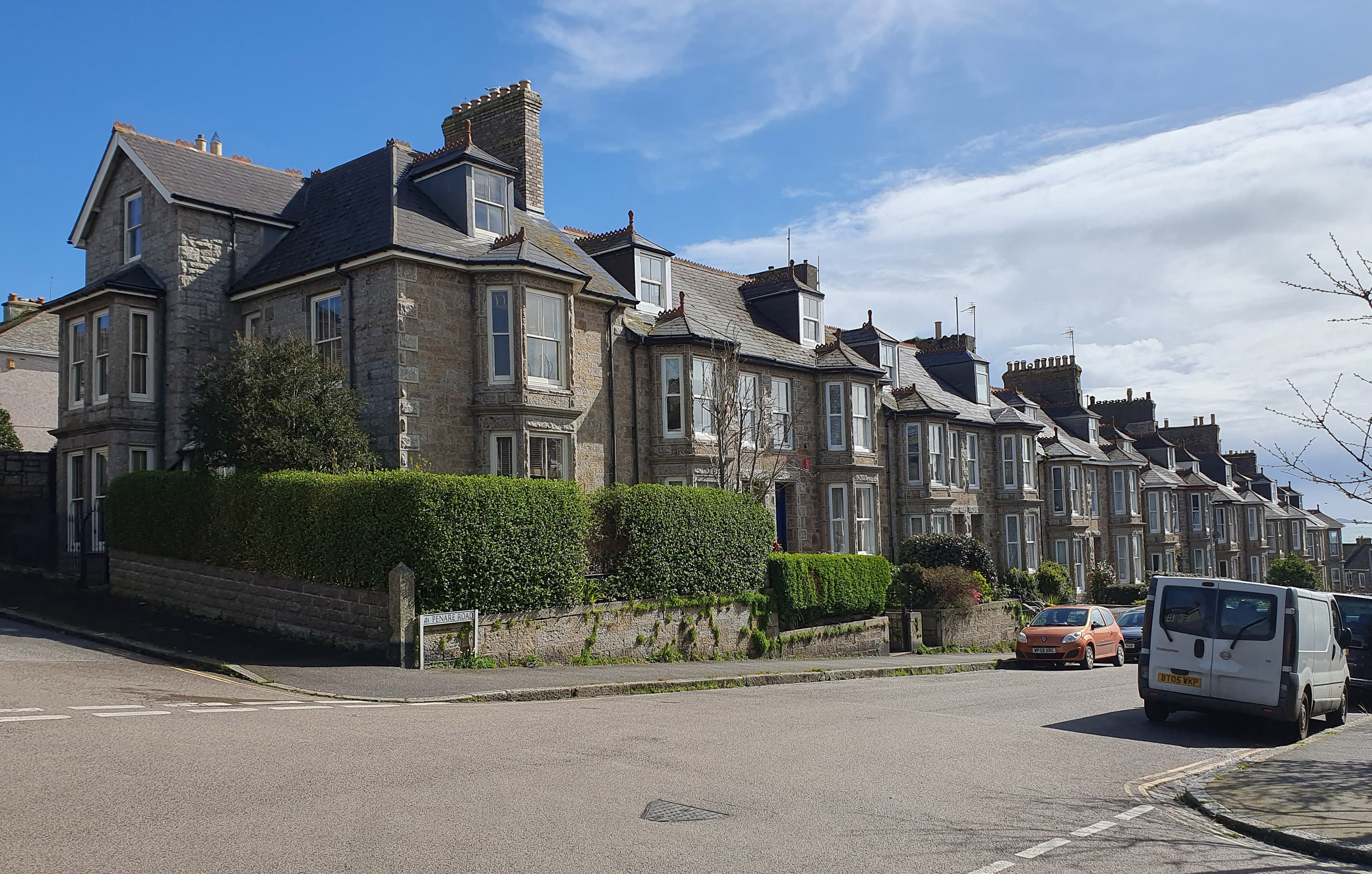 A row of terraced houses on a residential street, the kind of home movers sell and buy