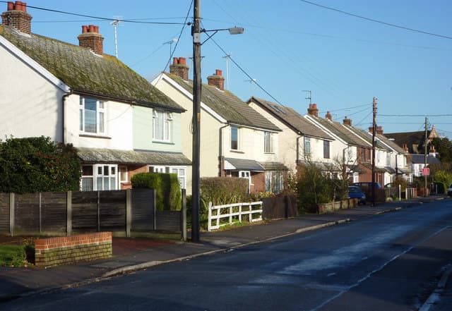 Semi-detached houses lining a residential street in Tiptree, Essex