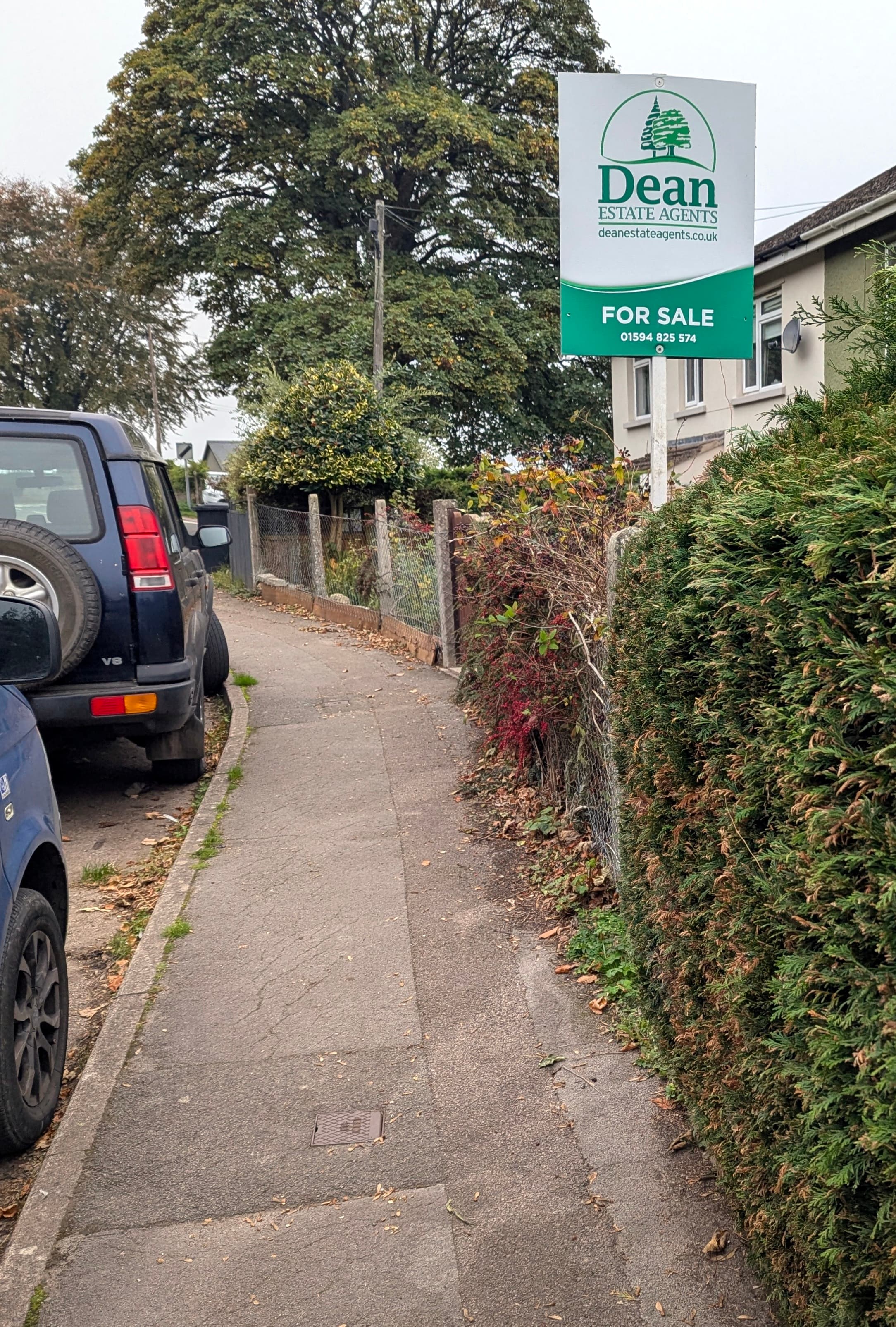 A For Sale sign back up outside a house, standing for a home returning to the market after a sale fell through
