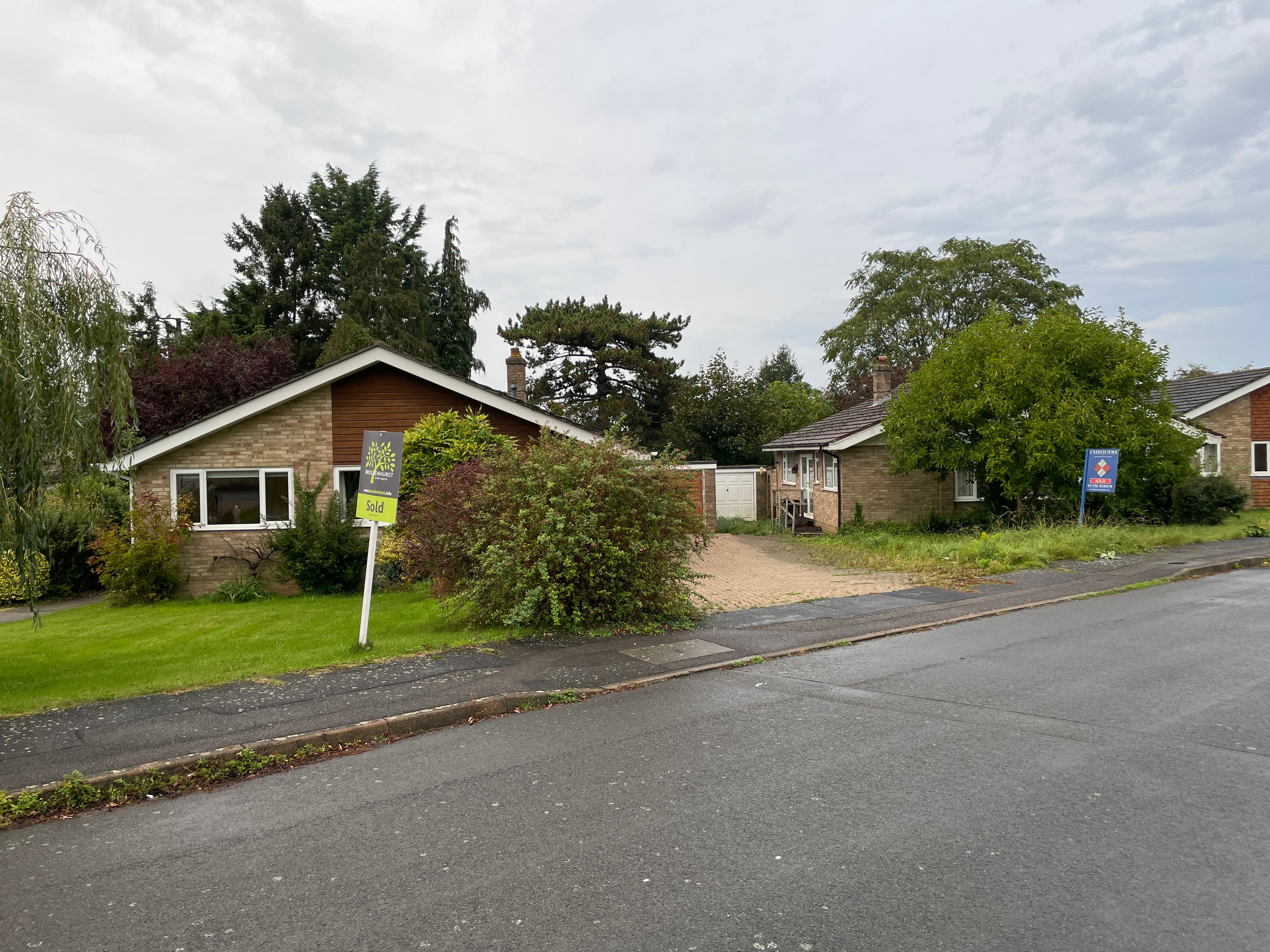 A Sold estate agent board outside a UK house with no sign of anyone having moved in