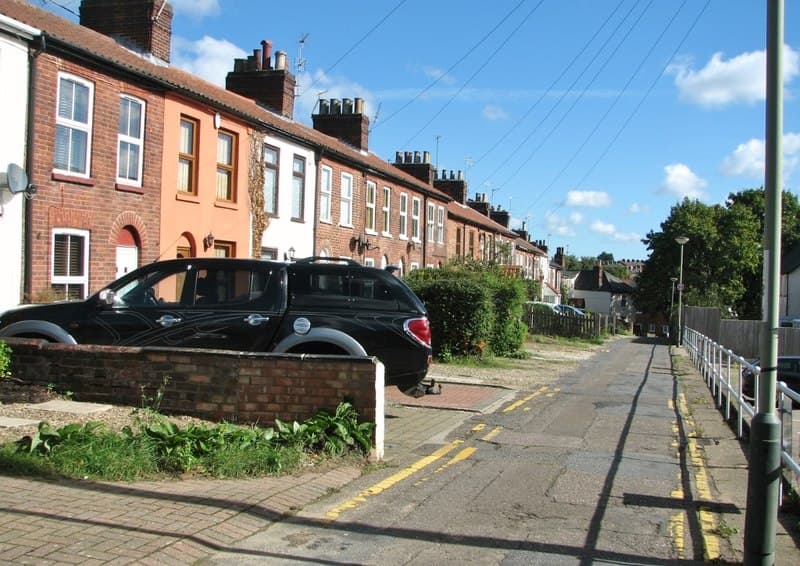 A row of British terraced houses on a residential street