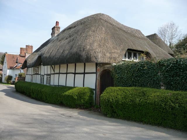 A thatched cottage in an English village, a property type mainstream mortgage lenders often decline