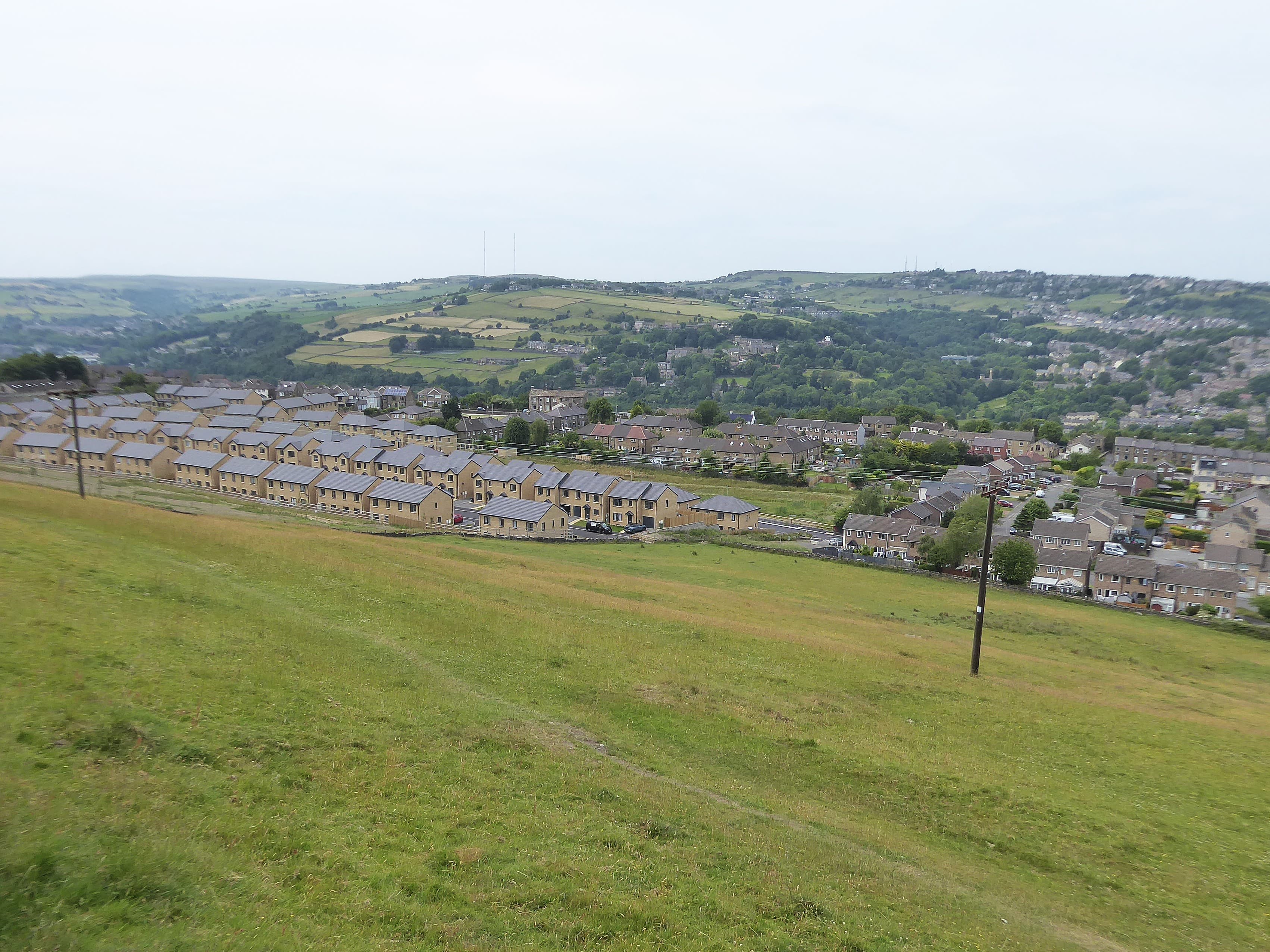 A newly built housing estate of modern homes in England under a clear sky