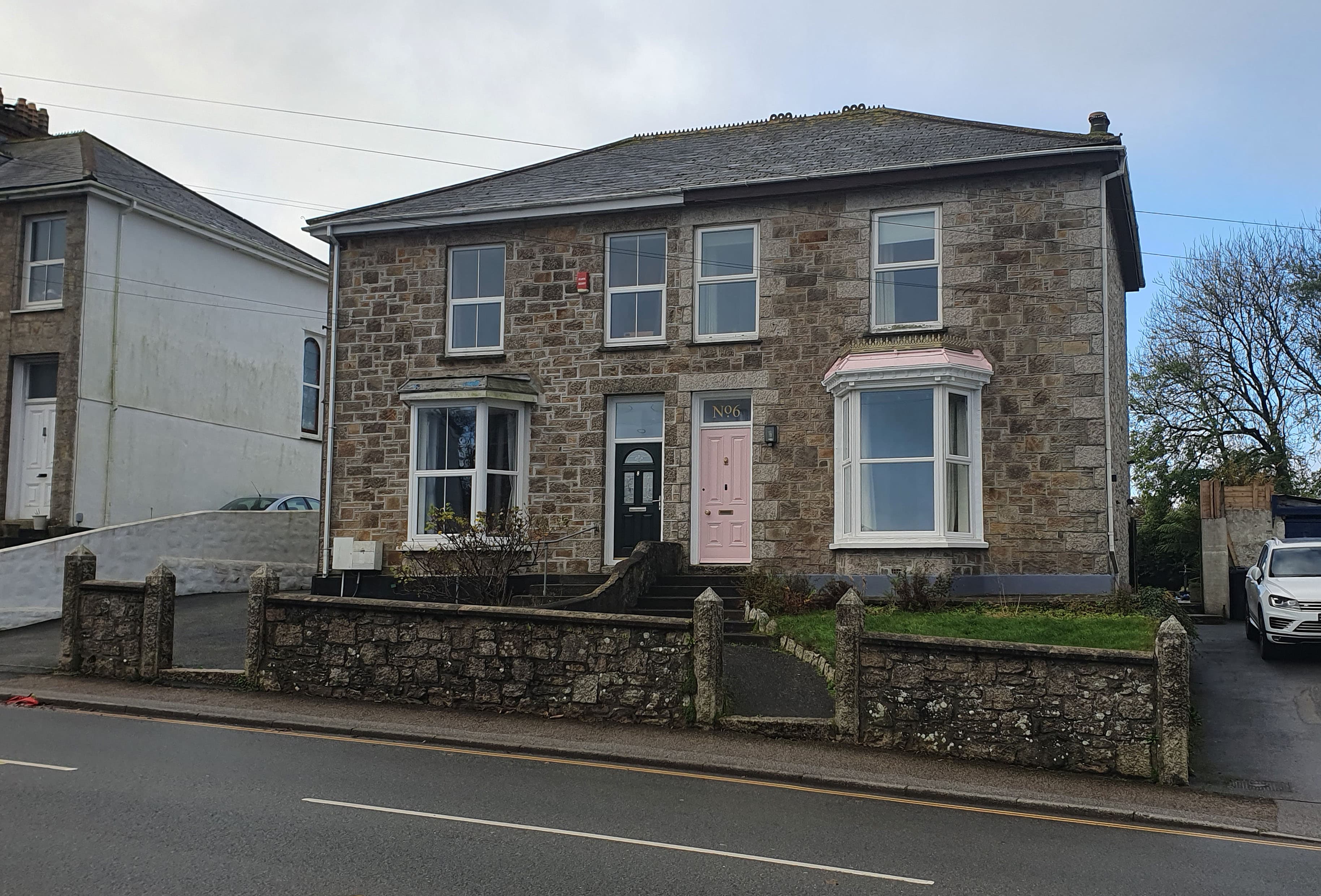 A row of semi-detached houses in England, the kind of home that changes hands on completion day